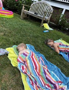 Kids sleeping on lawn