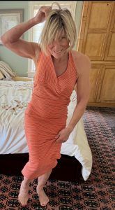 polli trying on orange dress