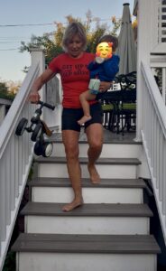 Polli going down deck stairs with Logan 1