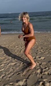 Polli-spinning-on-beach-611x1024-1