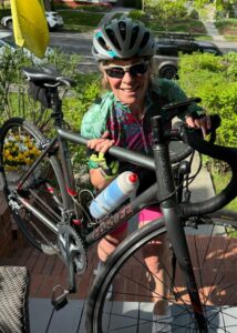 Polli-with-bike-732x1024-1