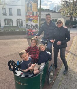 Ronnie-and-Polli-with-kids-in-wagon-888x1024-1